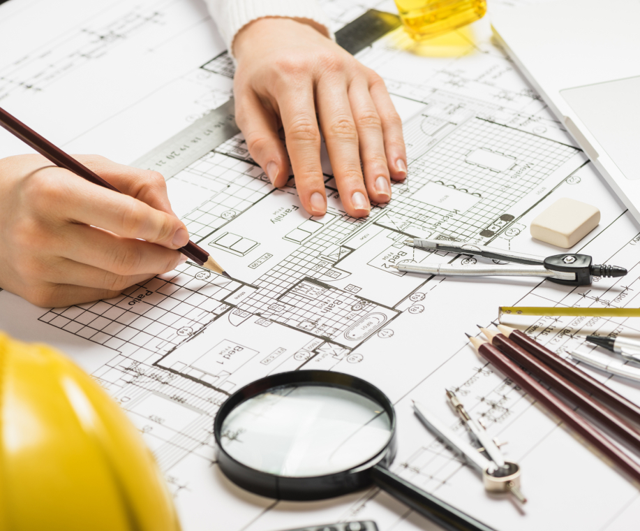 architect-drawing-plan-with-pencil